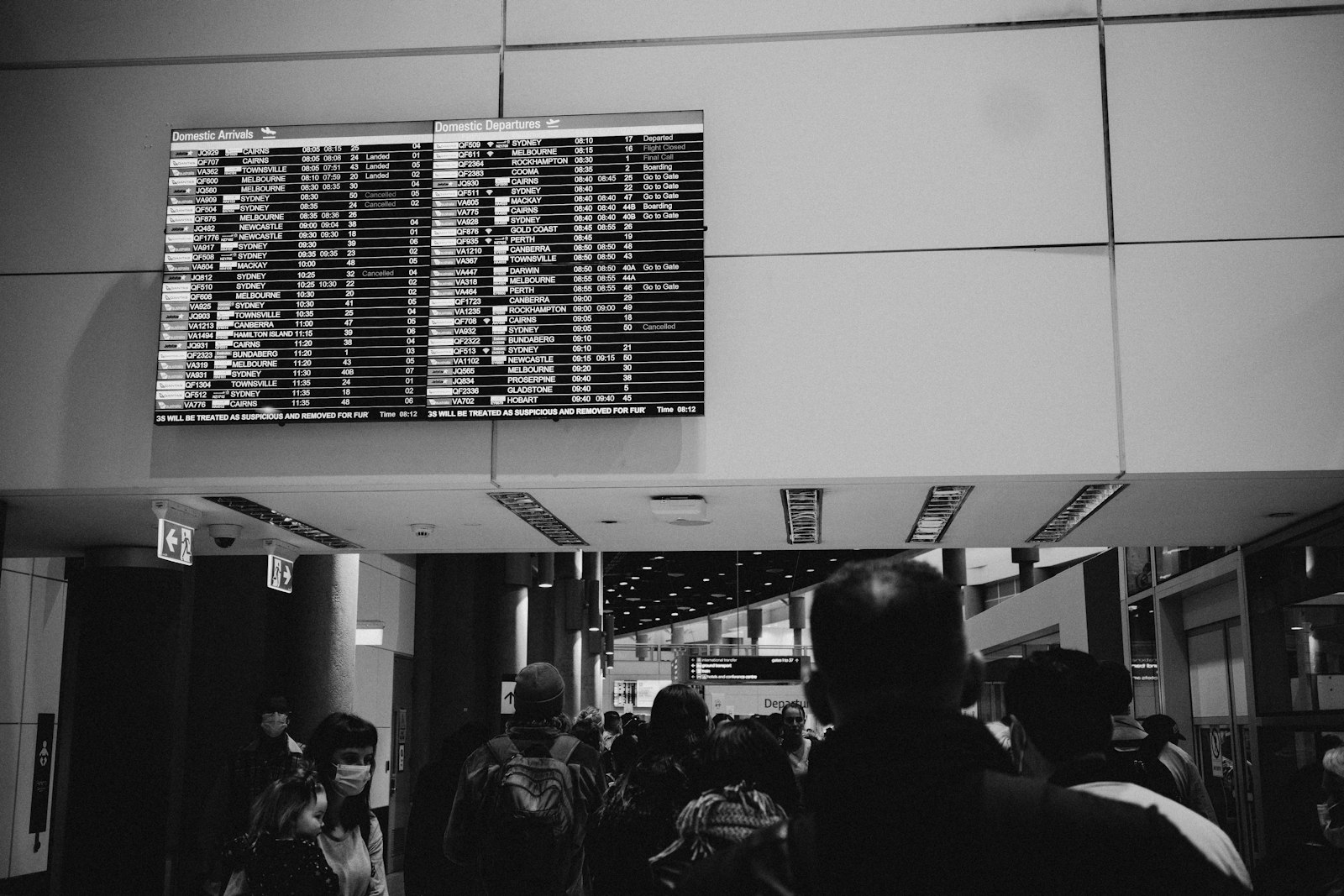 Airport departures board showing flight times