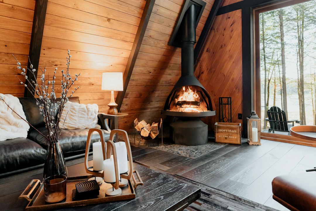 Cosy living room with a log fire burning, for a UK cottage Christmas