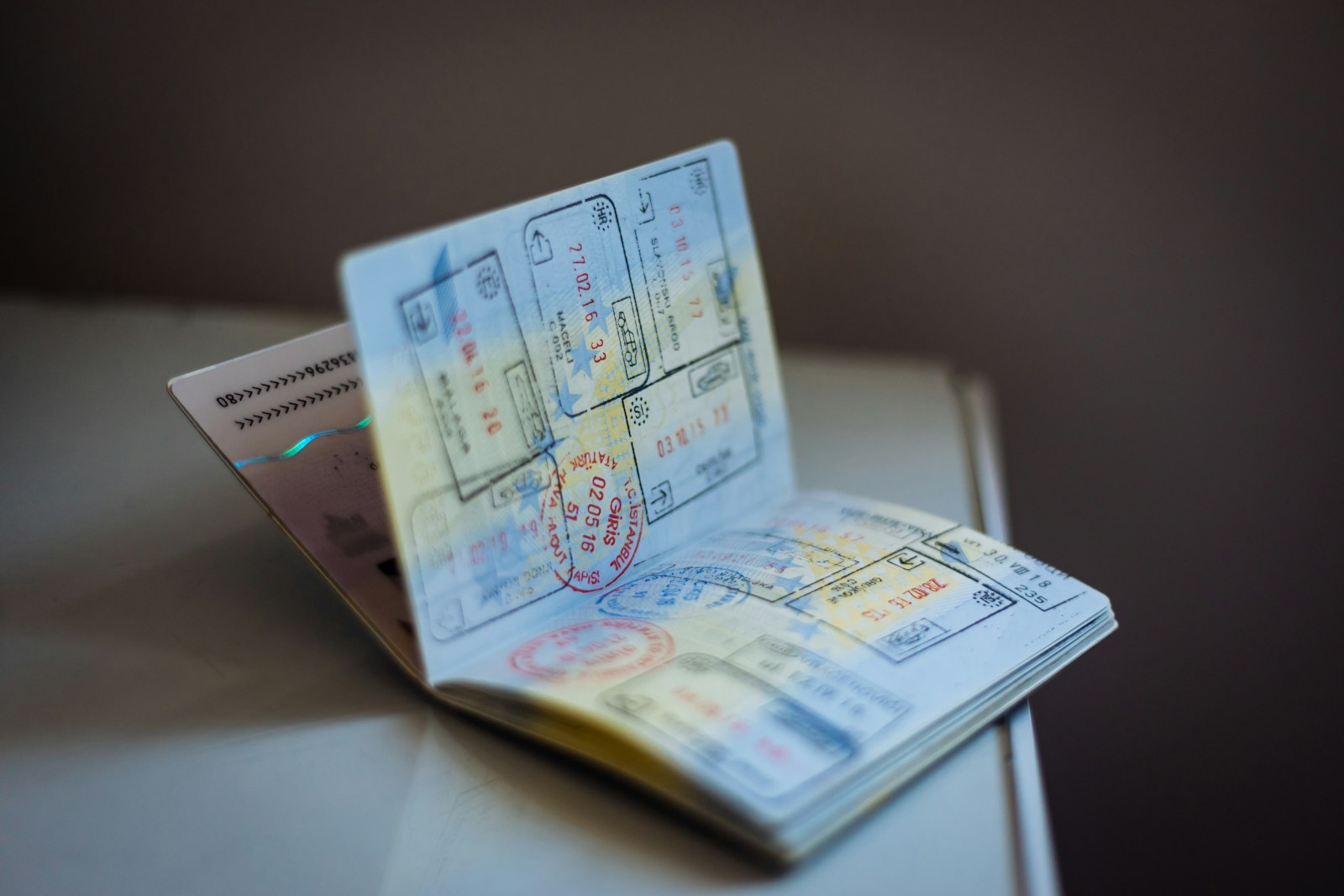 Open passport with travel stamps on a table